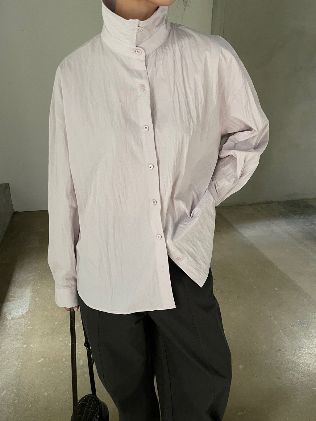 Ivory high-collar button-front shirt detail