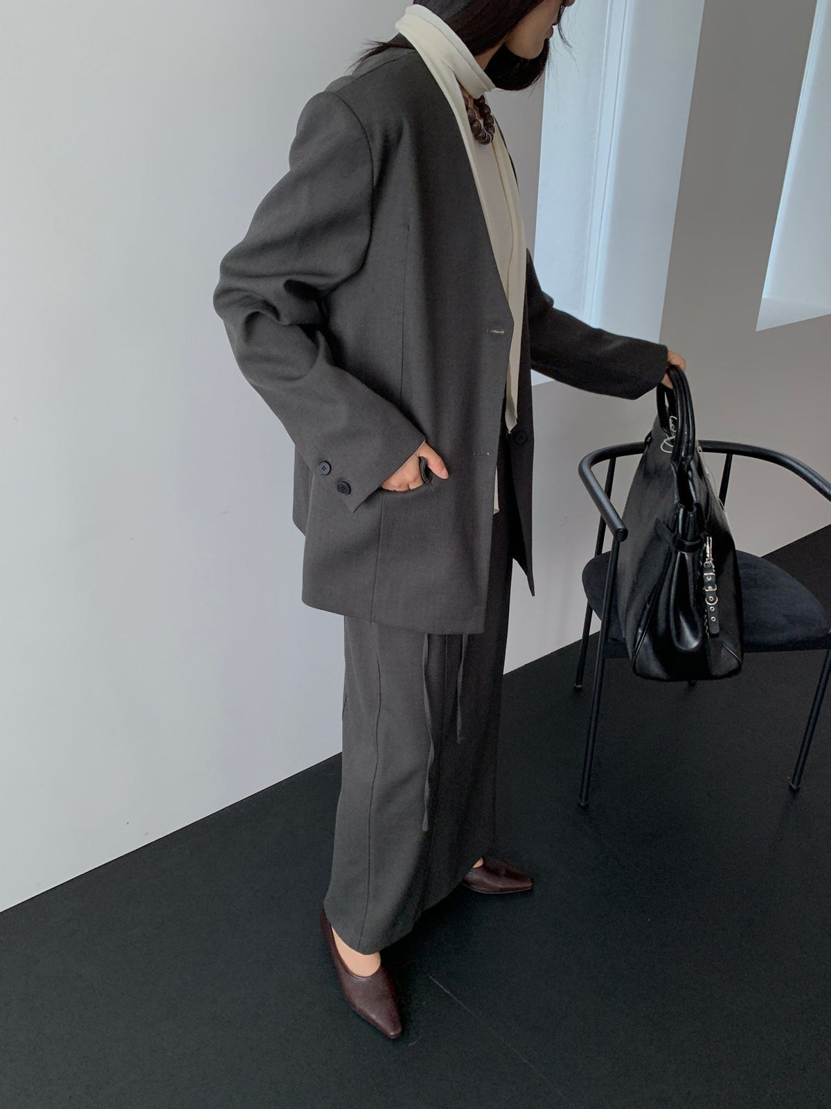 Charcoal Roa jacket styled with a long skirt