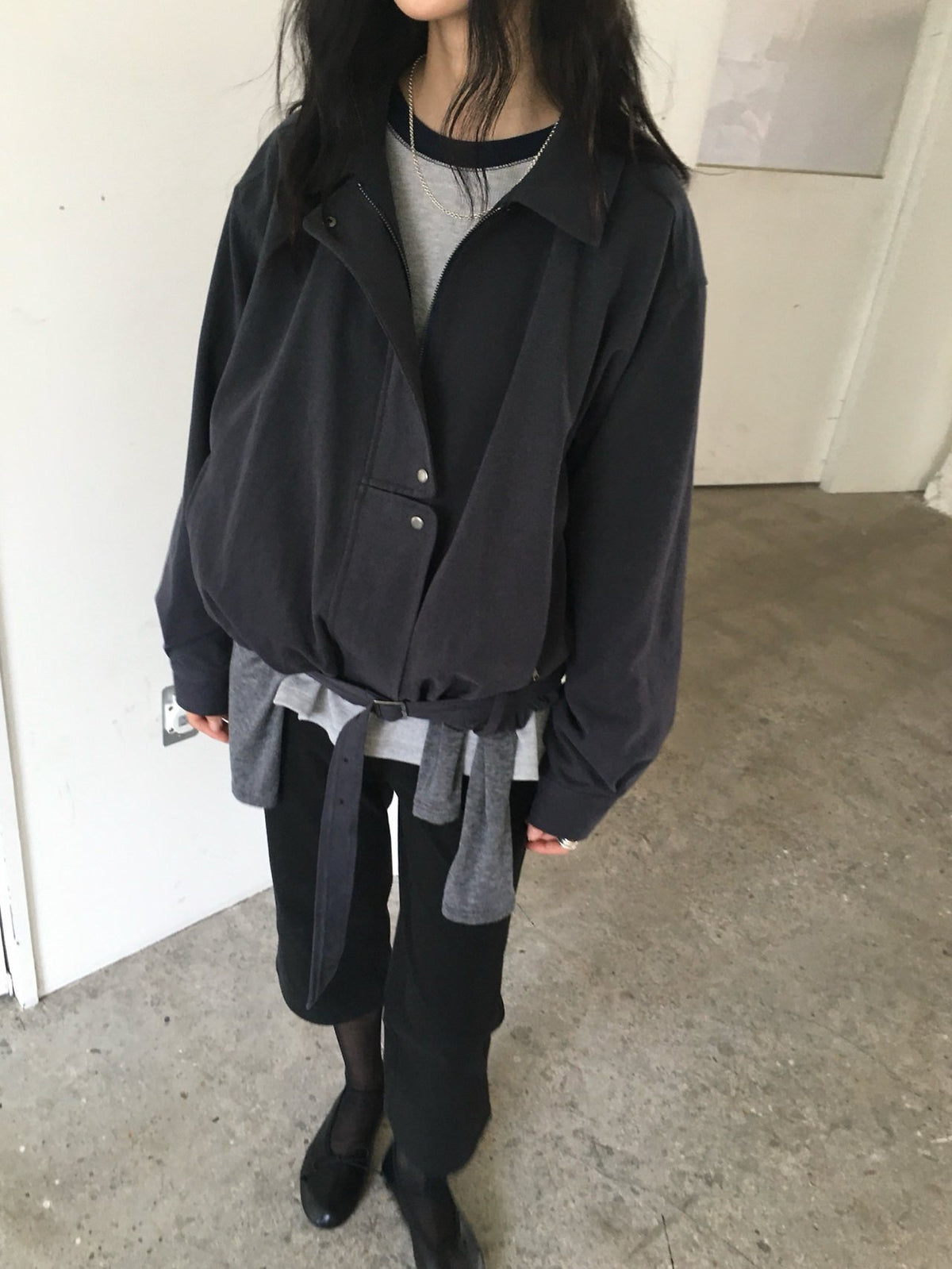 Front view of navy cotton blouson jacket with collar and pockets