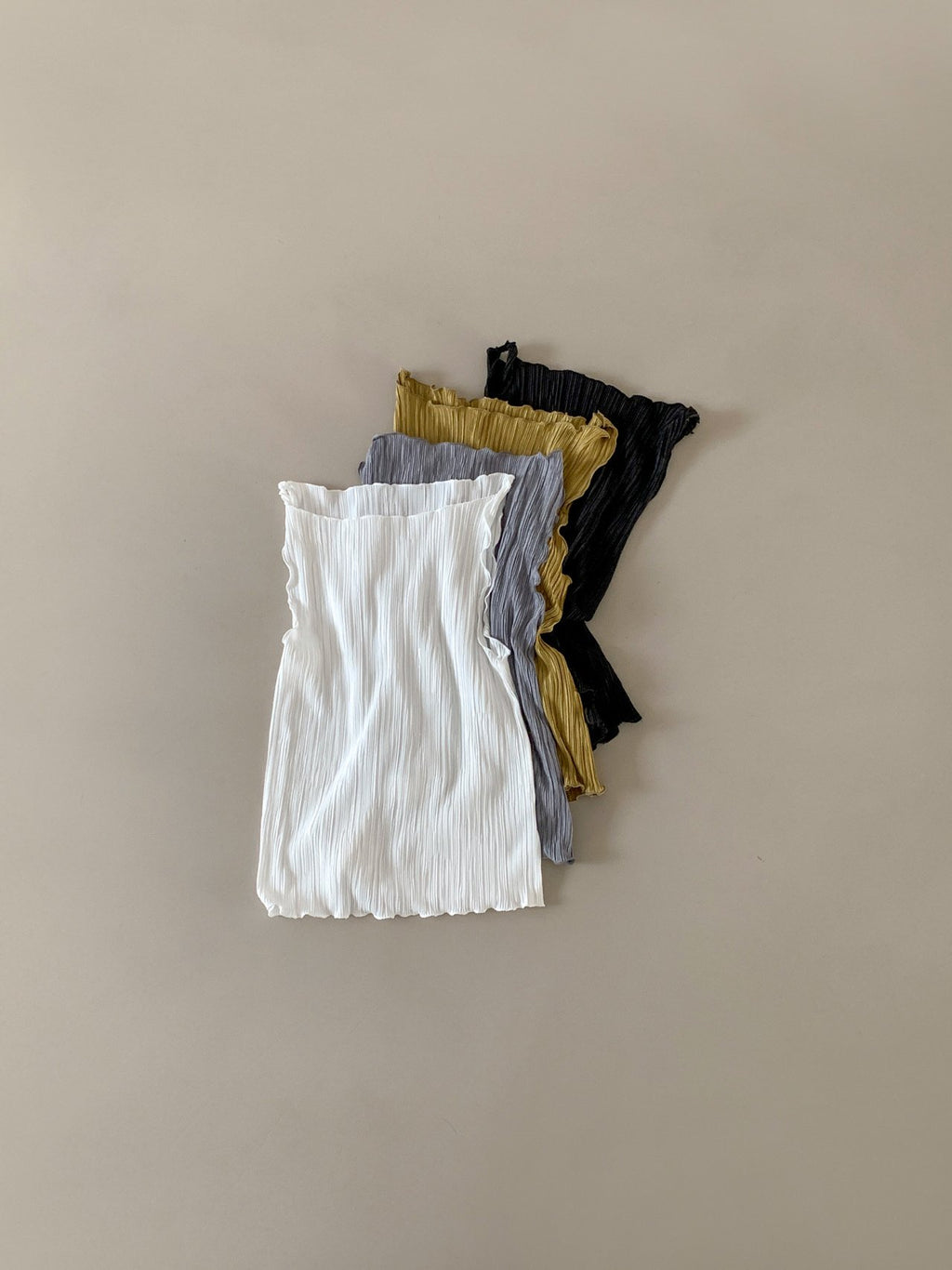 Moment pleated boat neck tank top in Light Khaki, front view standing with jeans