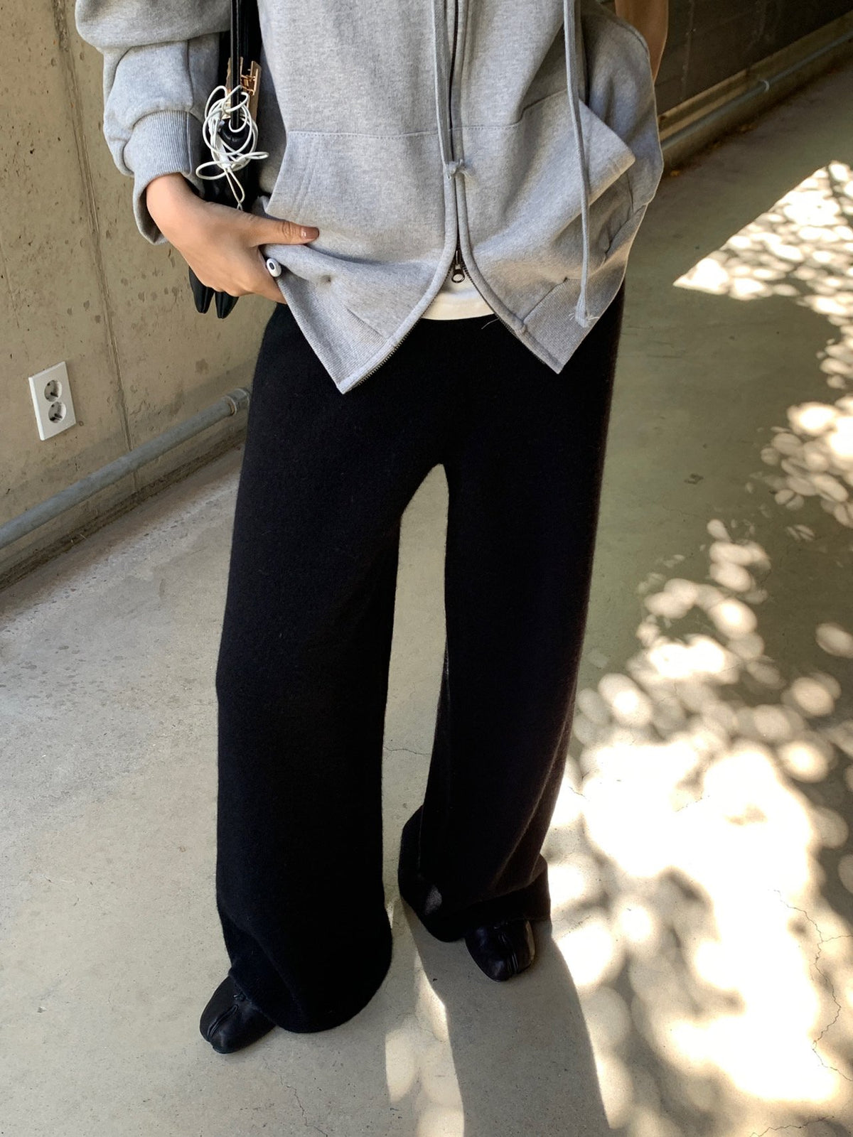 Brown full-length wide-leg knit pants styled with a matching-colour sweater