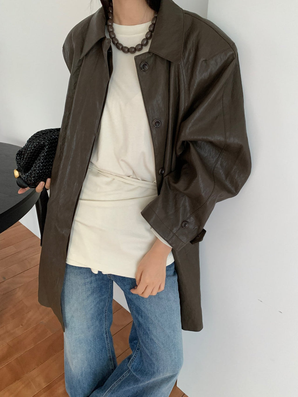 Close-up of Lucysalon leather-look shirt jacket sleeve and cuff