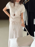 Brown short-sleeve mock neck top and drawstring maxi skirt set
