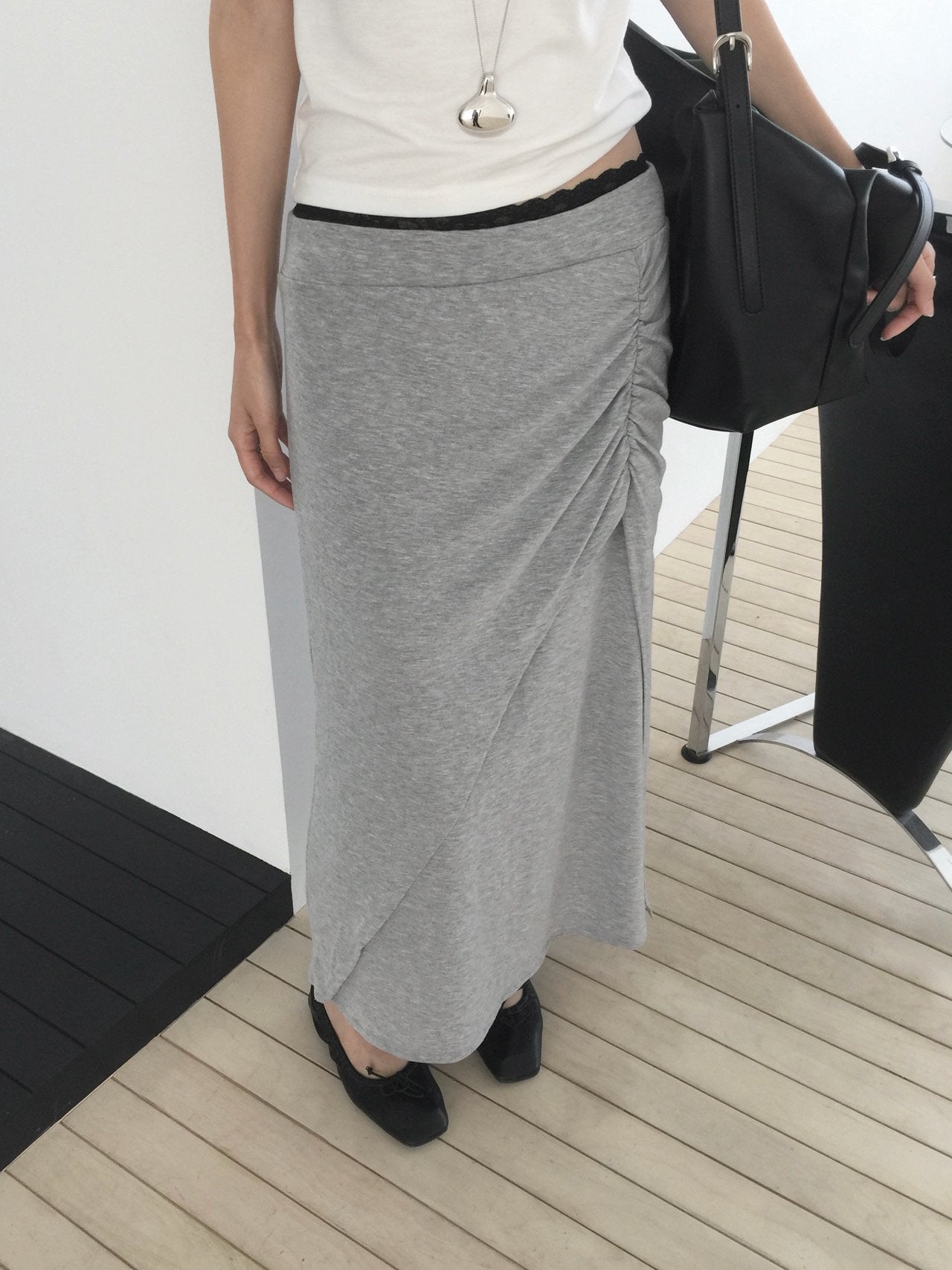 Nweol side ruched maxi skirt in Charcoal, styled on model front view close-up ruching and waistband detail