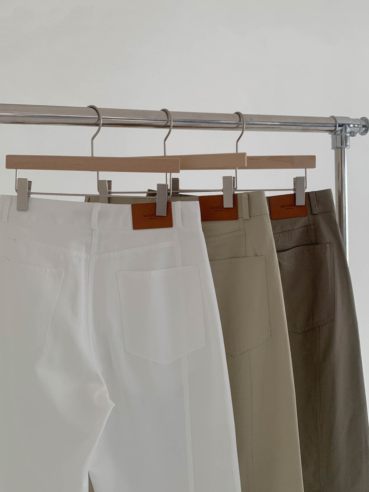Moment curved seam wide leg pants in White, front view full length on model with belt