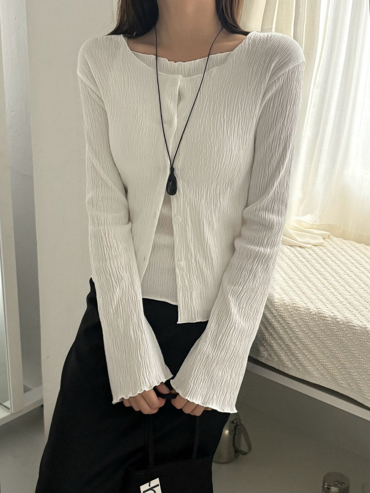 Melange gray pleated cardigan layered over a matching tank top