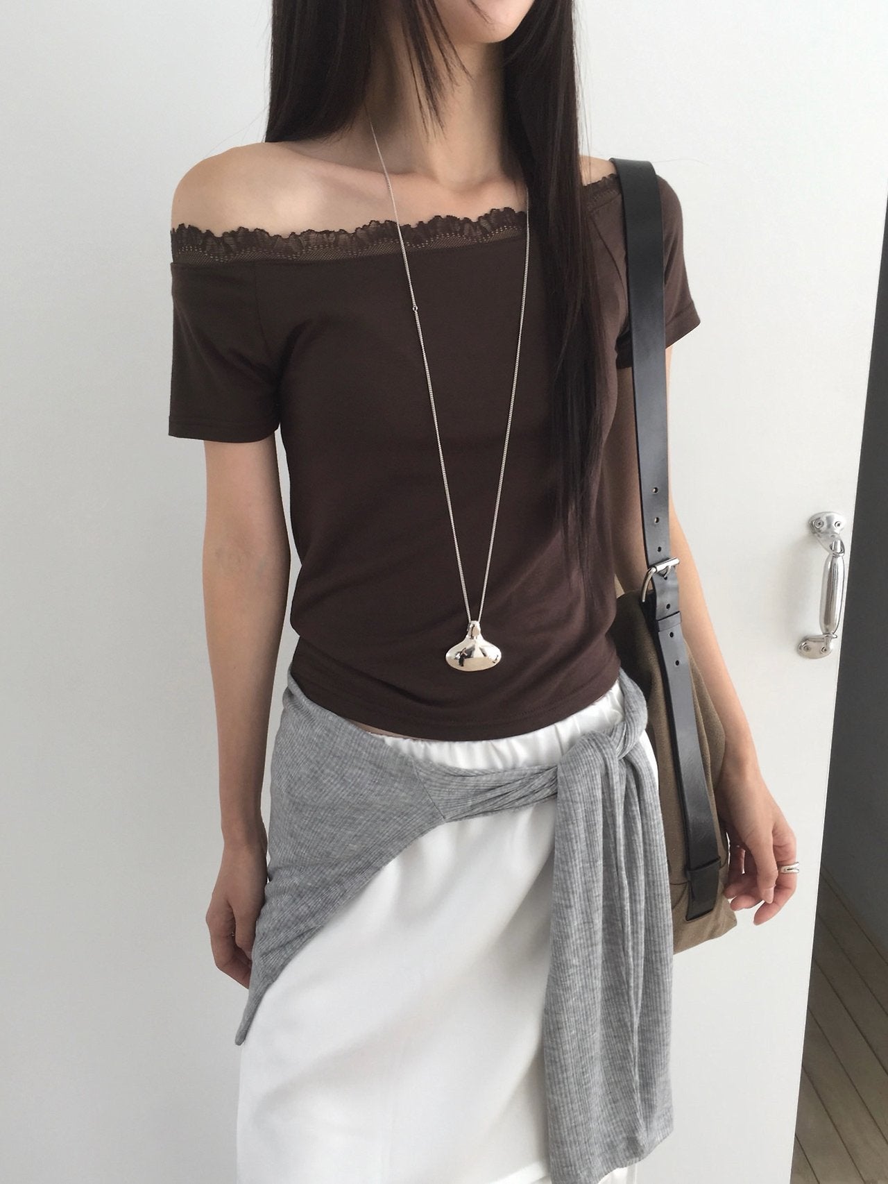 Nweol lace trim off-shoulder top in White, front view standing with bag