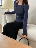 Front view of melange gray, brown, navy, and black layered top sets