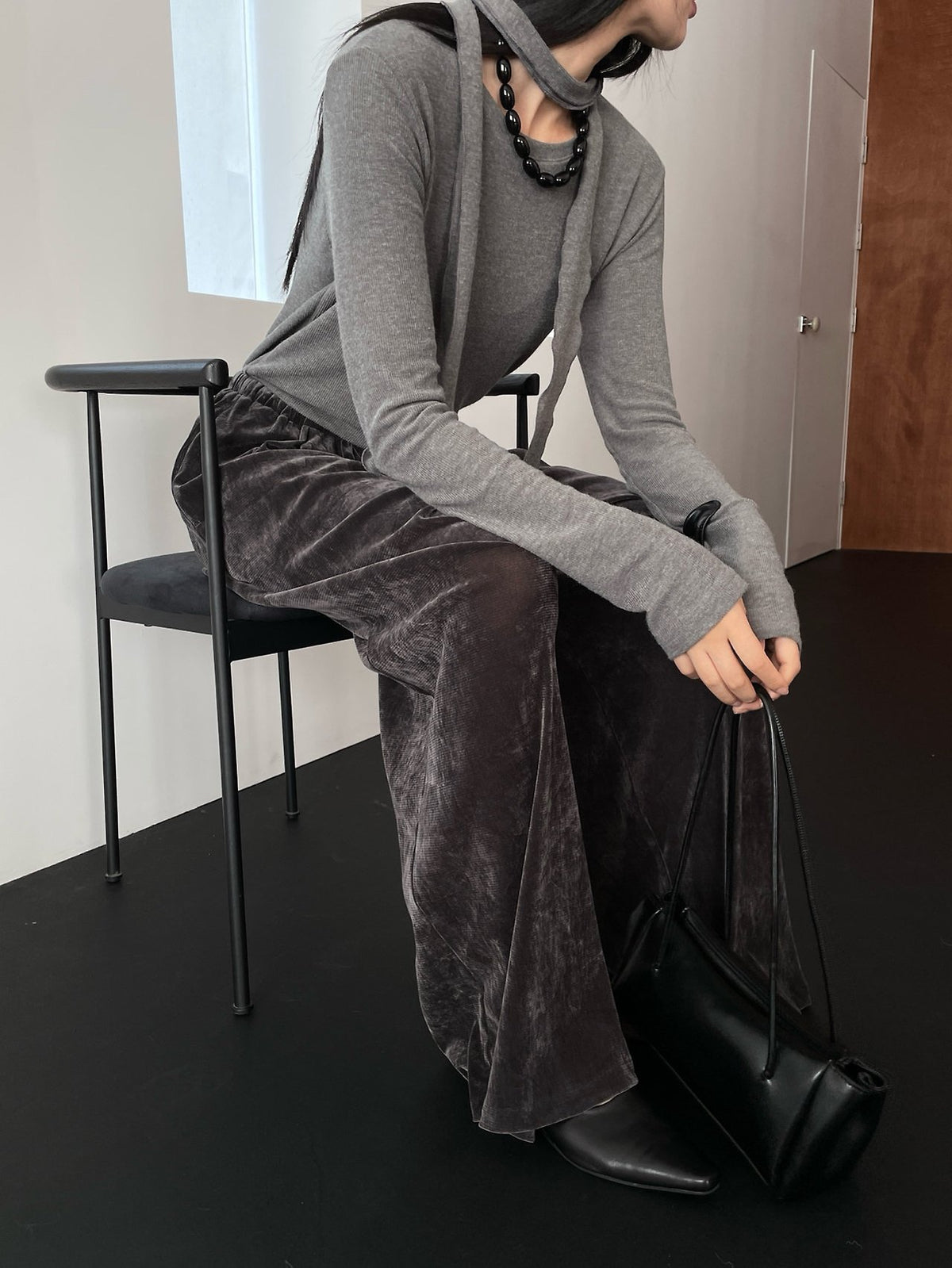 Charcoal velvet wide-leg pants styled with a knit top