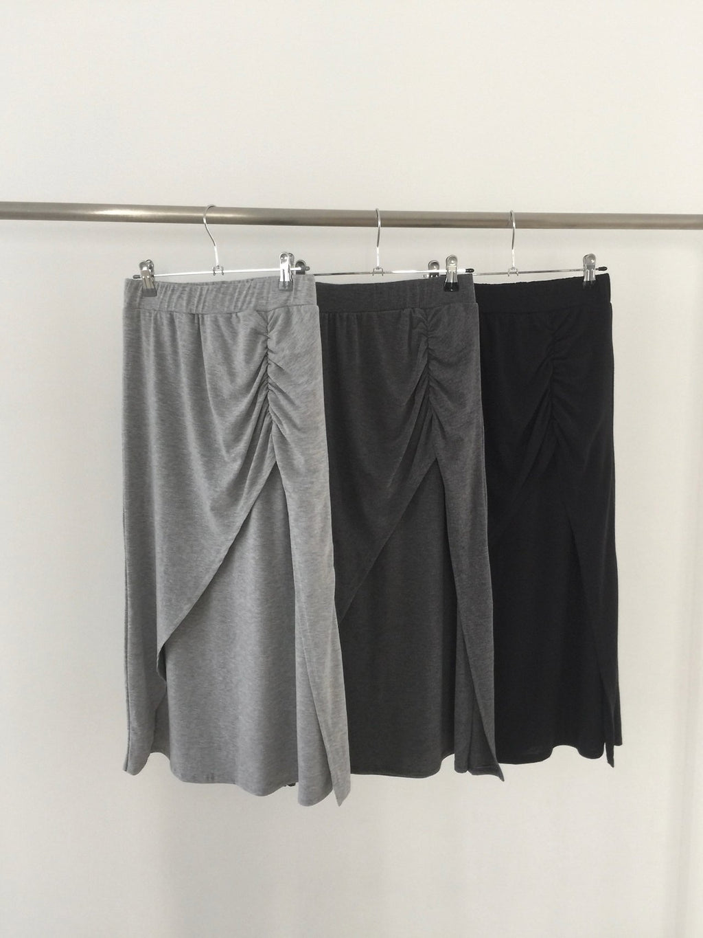 Nweol side ruched maxi skirt in Charcoal, styled on model side view with white tank top and black bag