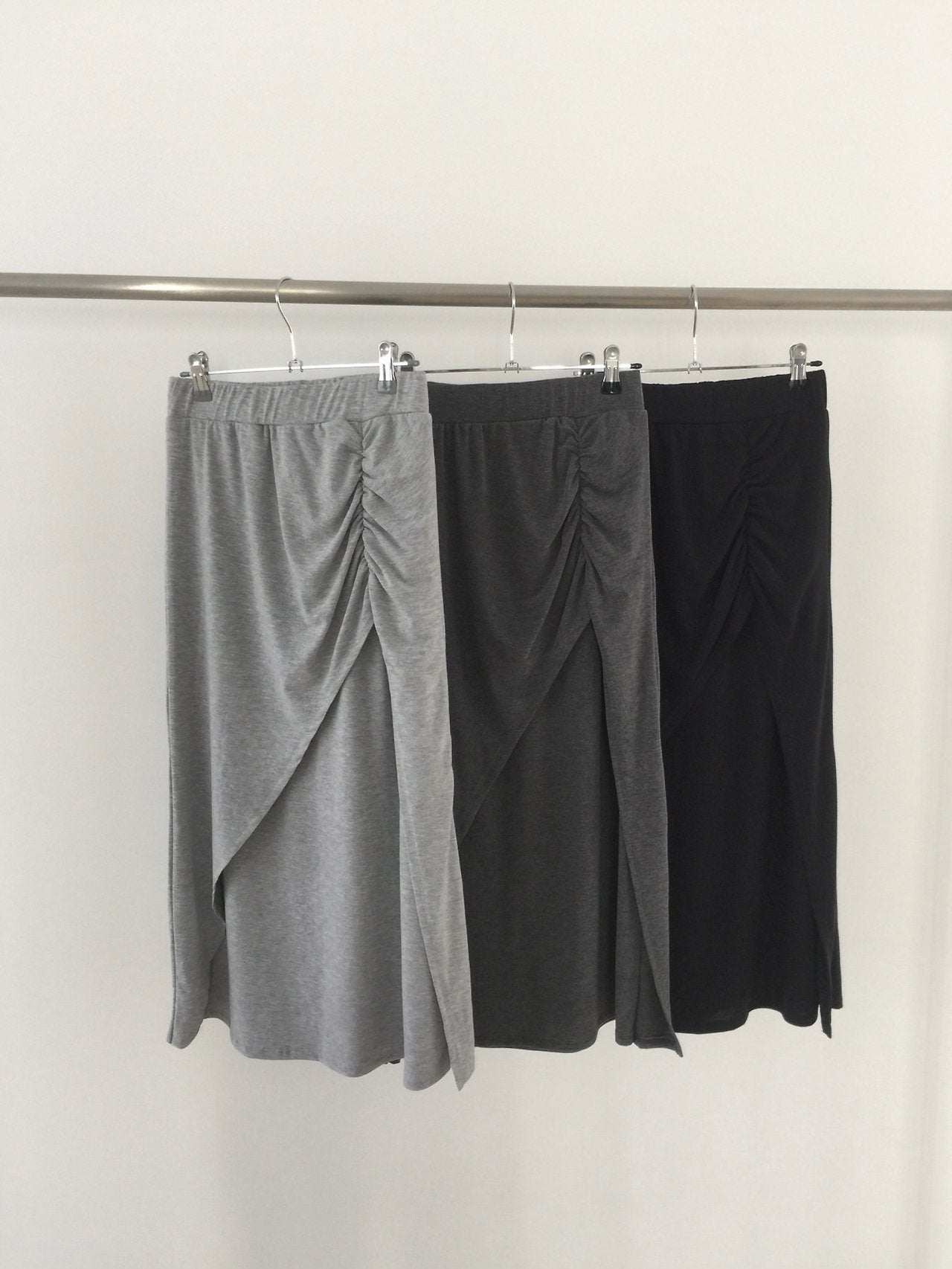 Nweol side ruched maxi skirt in Charcoal, styled on model side view with white tank top and black bag
