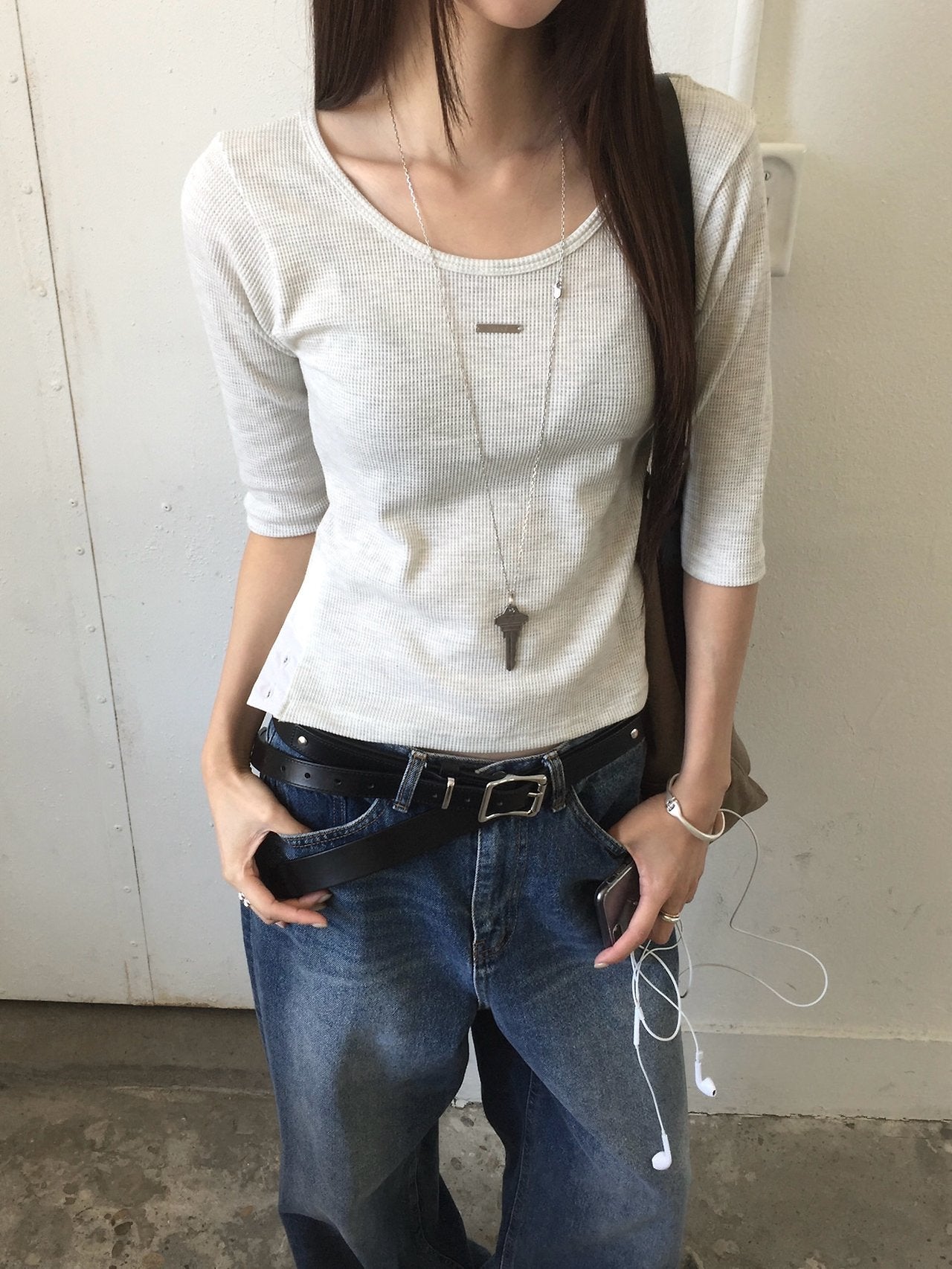 Nweol waffle knit crop half sleeve top in Black, White Melange and Ivory, three colorways on rack front view