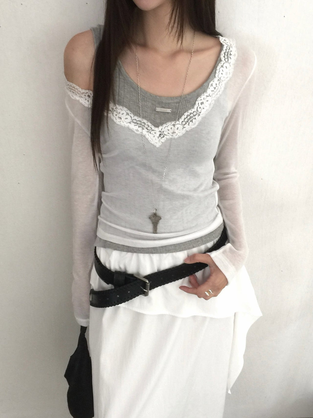 Nweol lace trim V-neck long sleeve top in Grey, styled on model front view close-up lace neckline