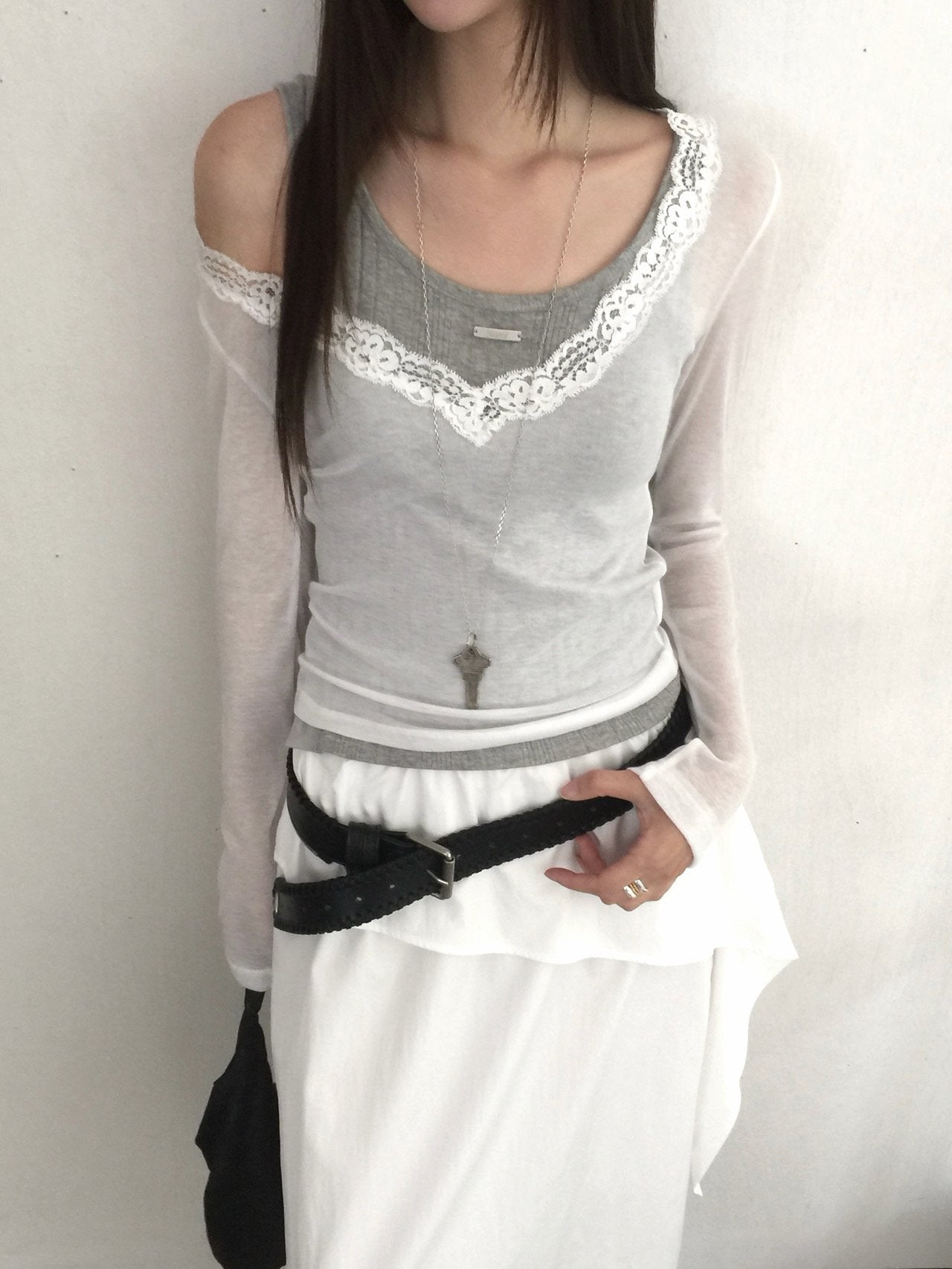 Nweol lace trim V-neck long sleeve top in Grey, styled on model front view close-up lace neckline