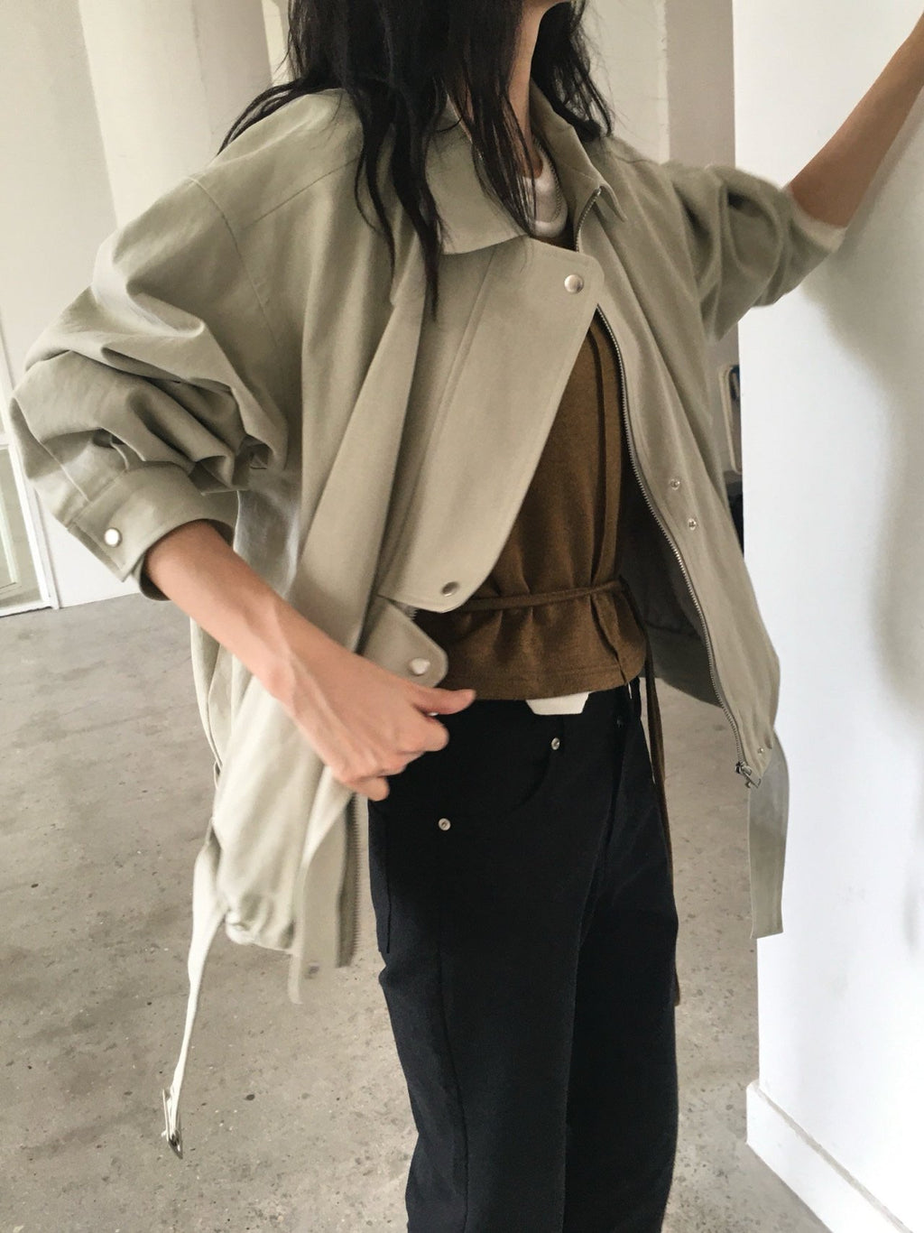 Back view of khaki beige and navy cotton blouson jackets with hem belts