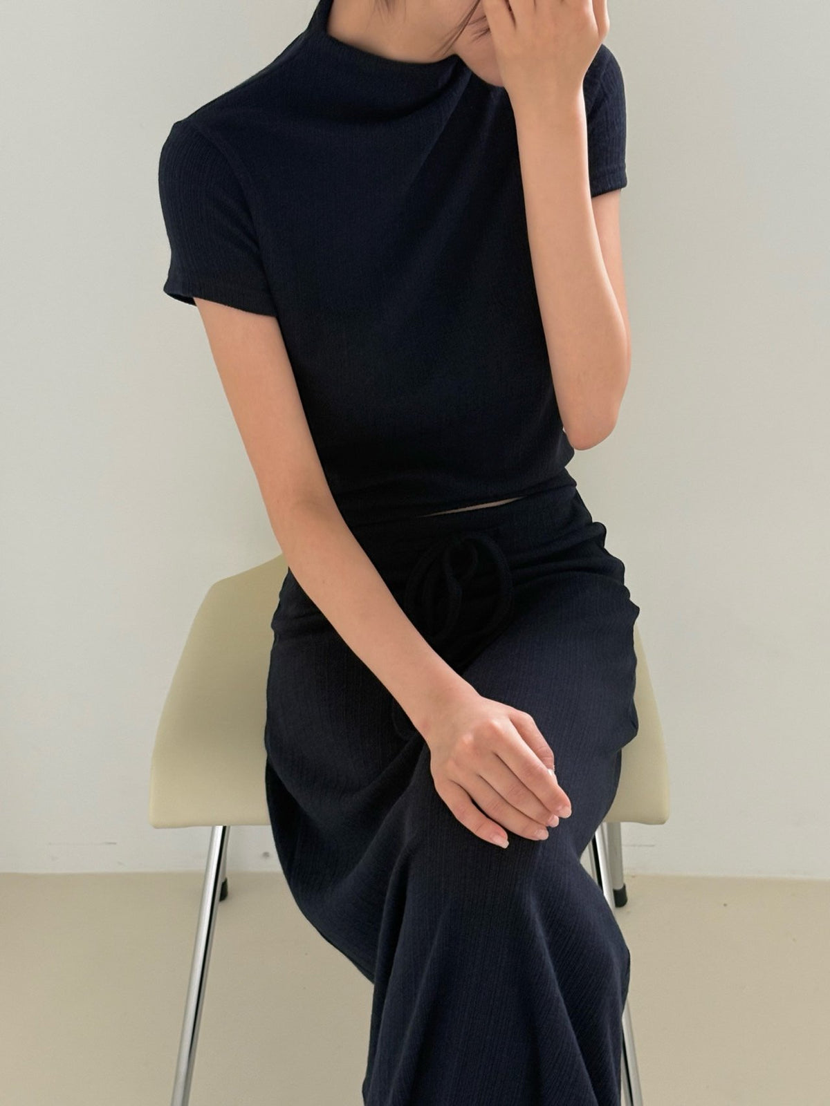 Pleated top and maxi skirt sets in cream, brown, navy, and black