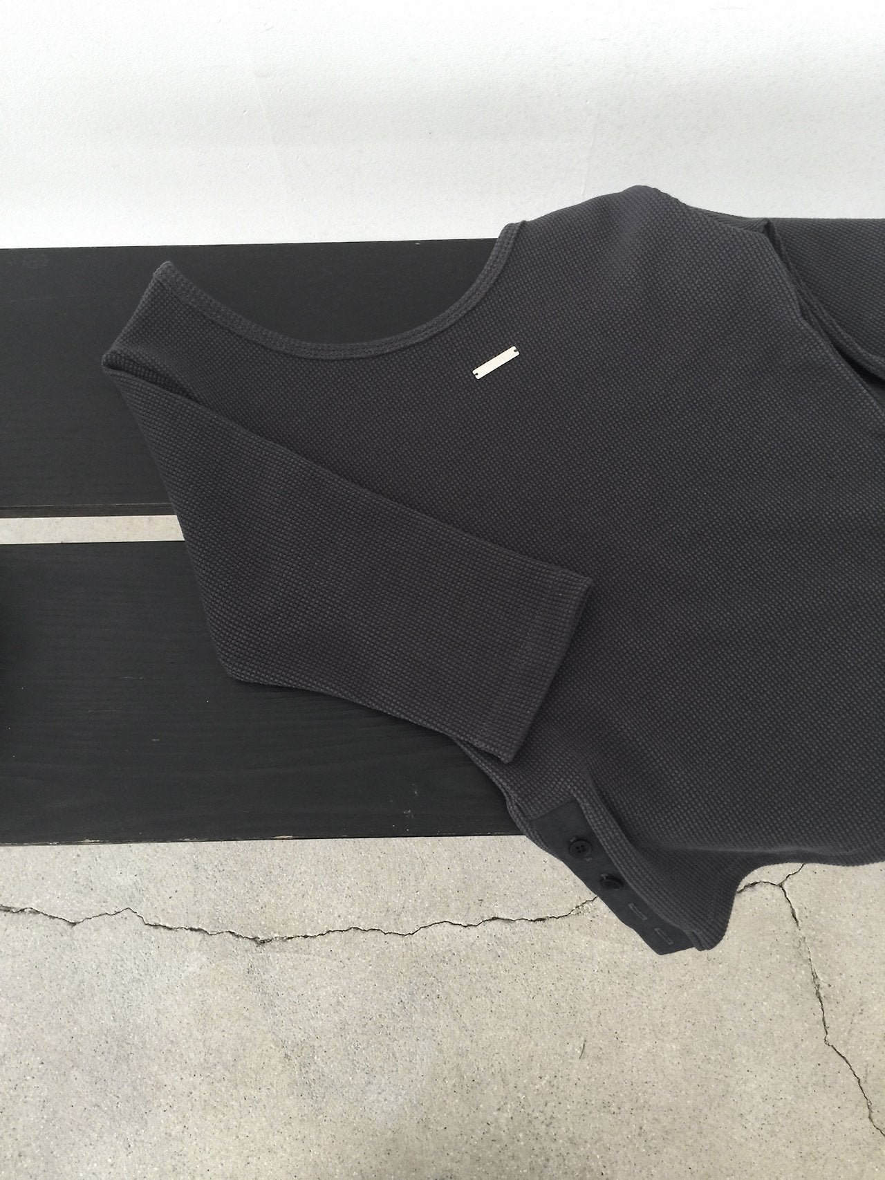 Nweol waffle knit crop top in White Melange, styled on model front view with jeans
