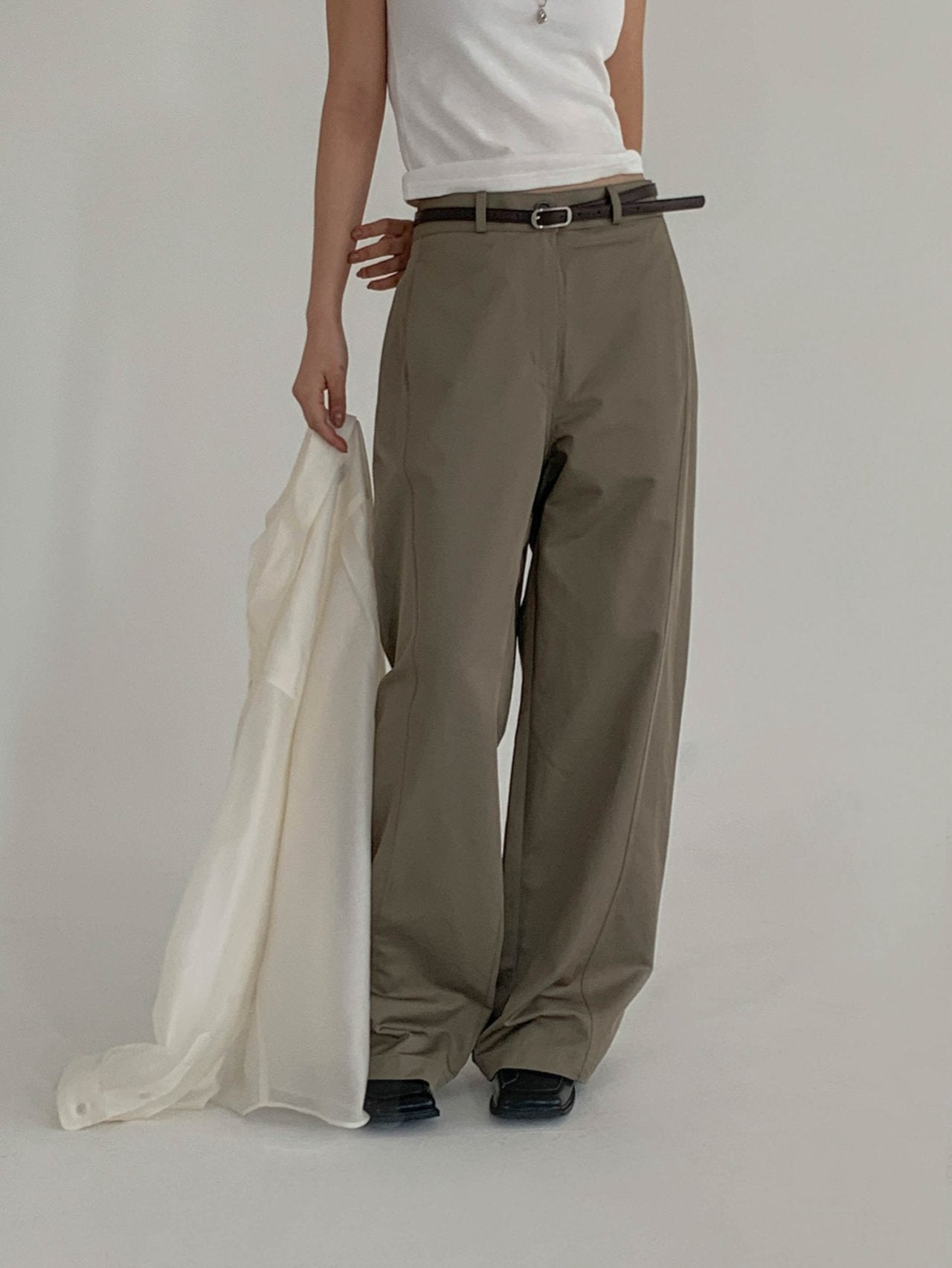 Moment curved seam wide leg pants, four colorways flat lay — White, Light Khaki, Beige, Black