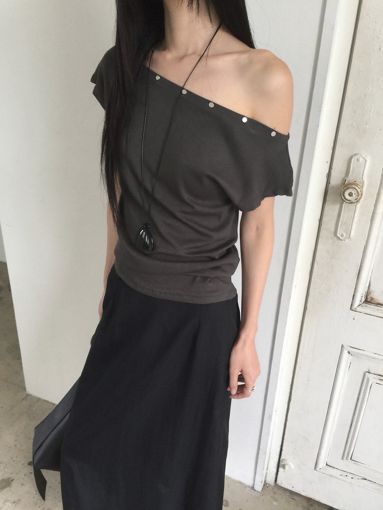 Nweol asymmetric one-shoulder top in Ivory, seated front view