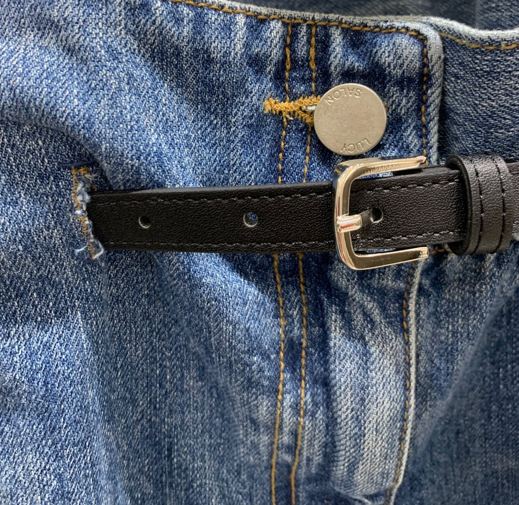 Side and back view of blue jeans showing back pocket and belt