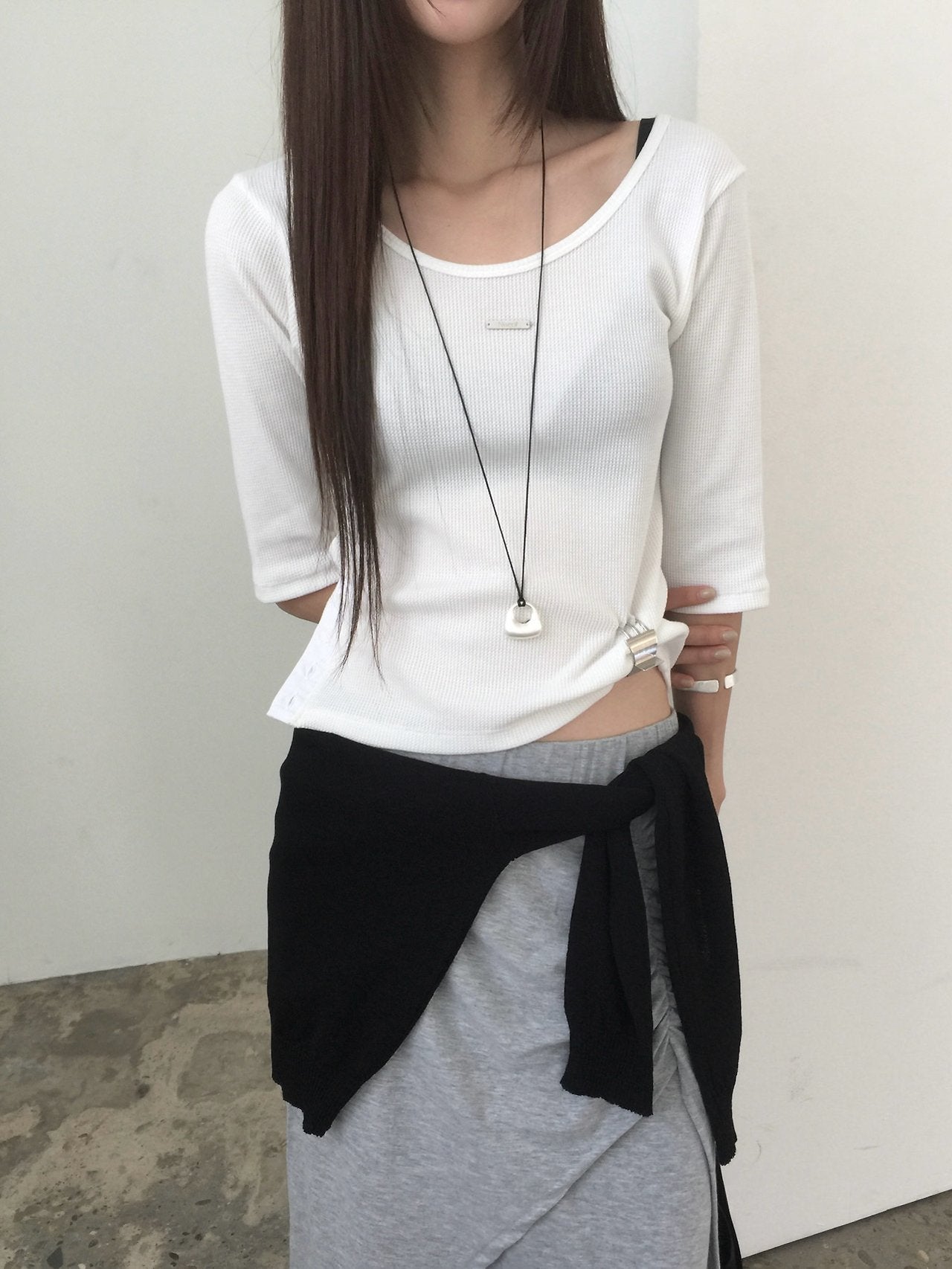 Nweol waffle knit crop half sleeve top in White Melange, product flat lay on hanger against white door front view