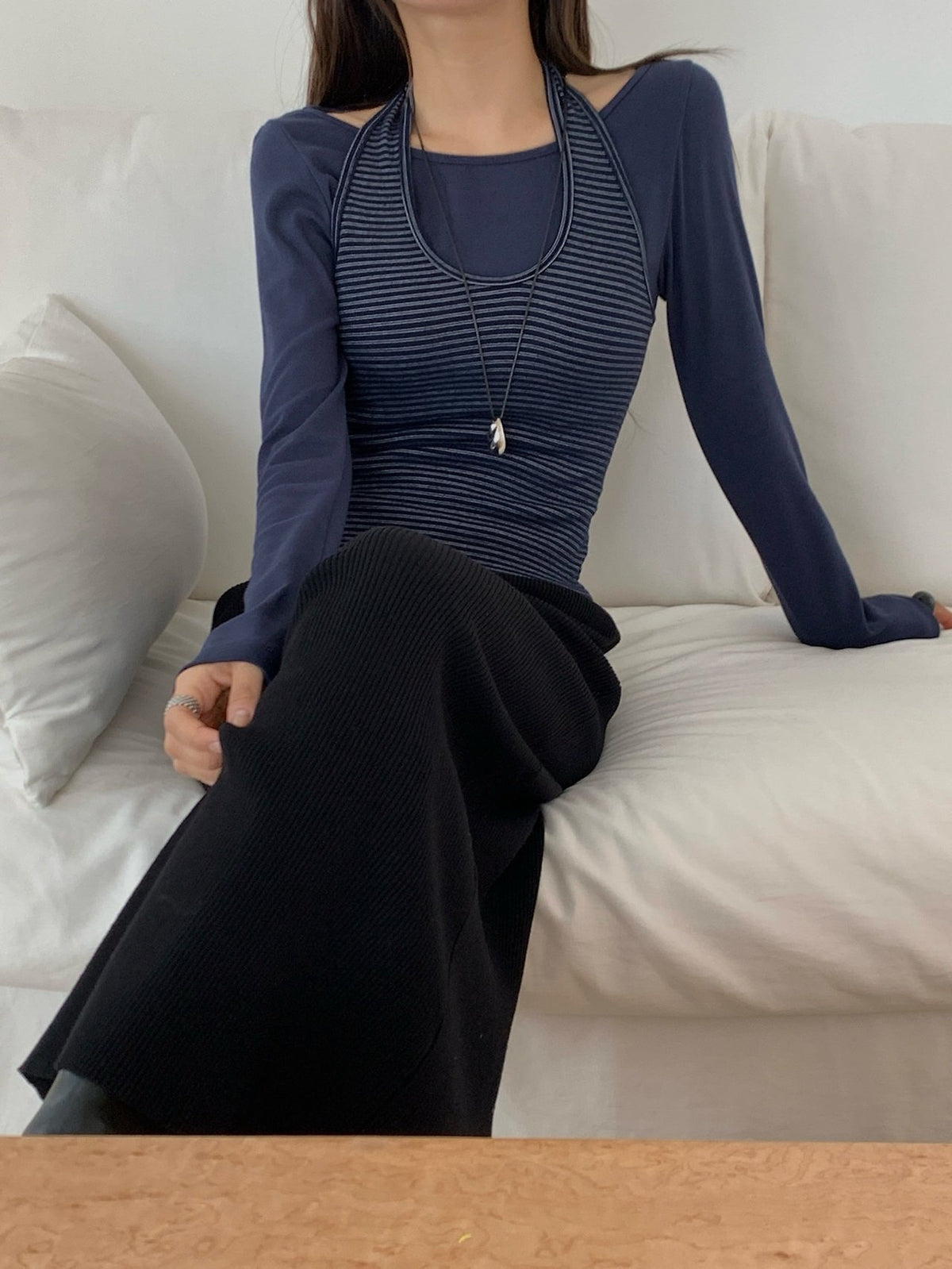 Navy striped tank top layered over a long-sleeve top