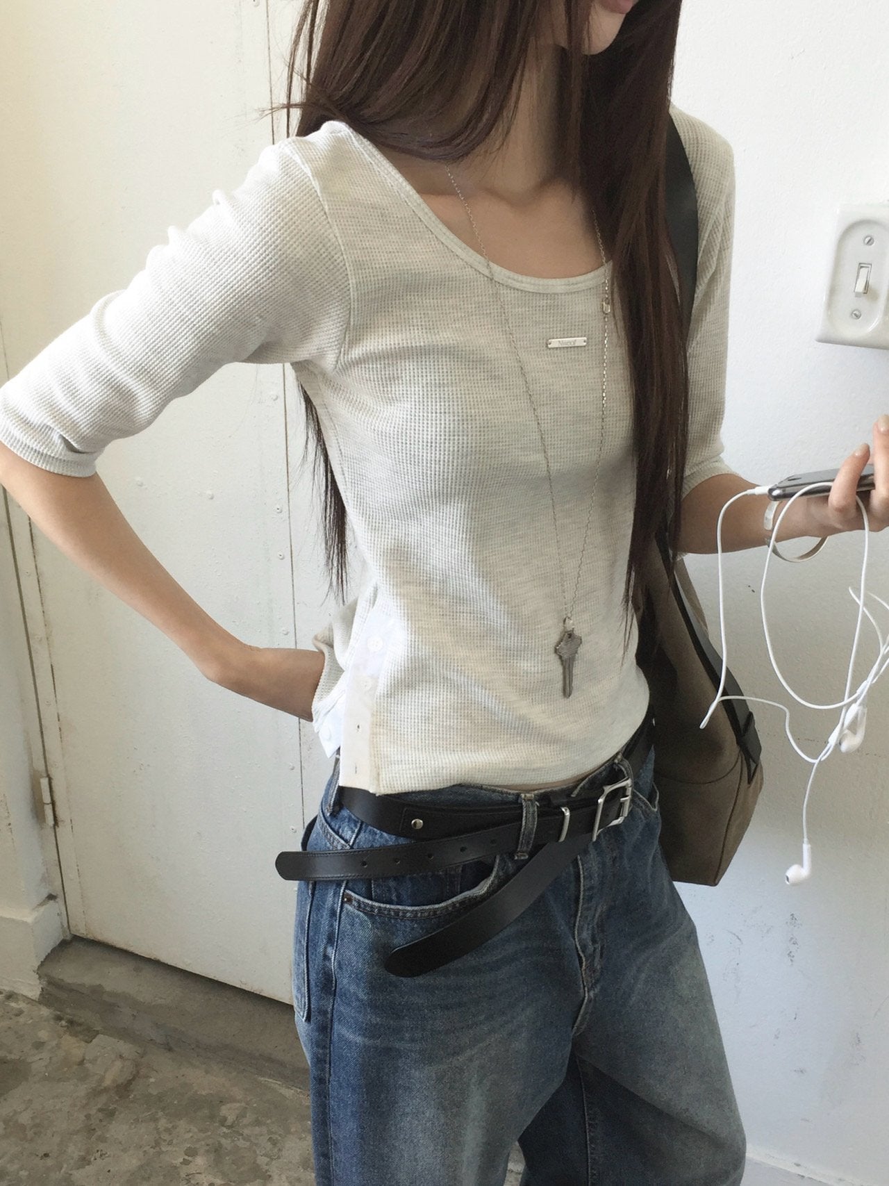 Nweol waffle knit crop top in Ivory, styled on model front view with grey skirt