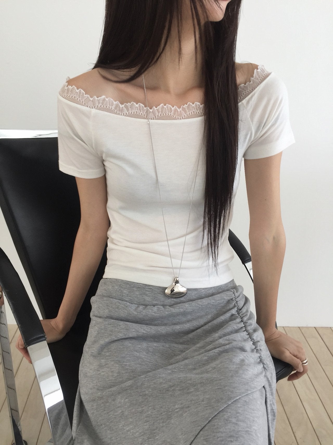 Nweol lace trim off-shoulder top in White, front view seated close-up
