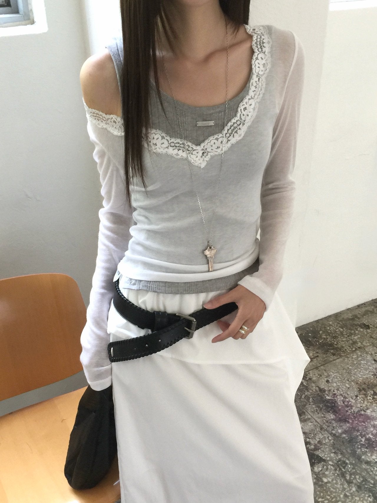 Nweol lace trim V-neck long sleeve top in Grey, styled on model front view with grey maxi skirt