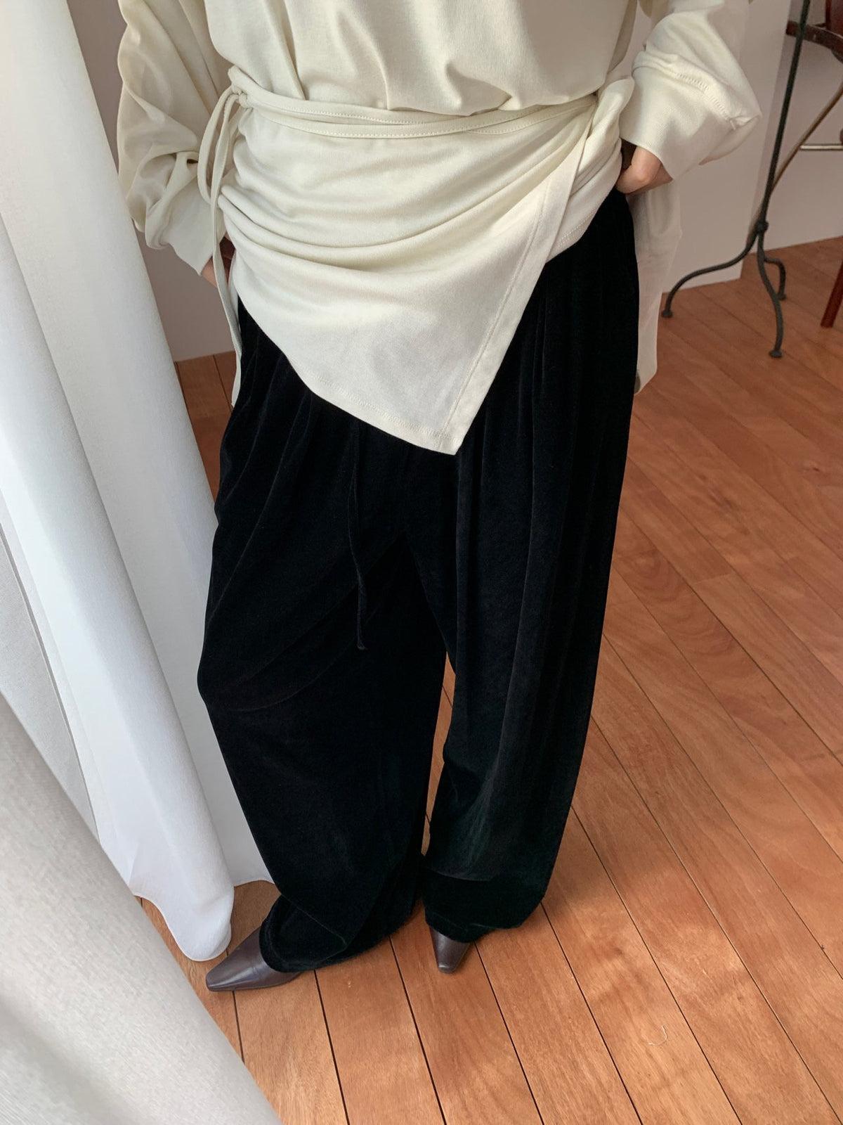 Black velvet wide-leg pants seated view