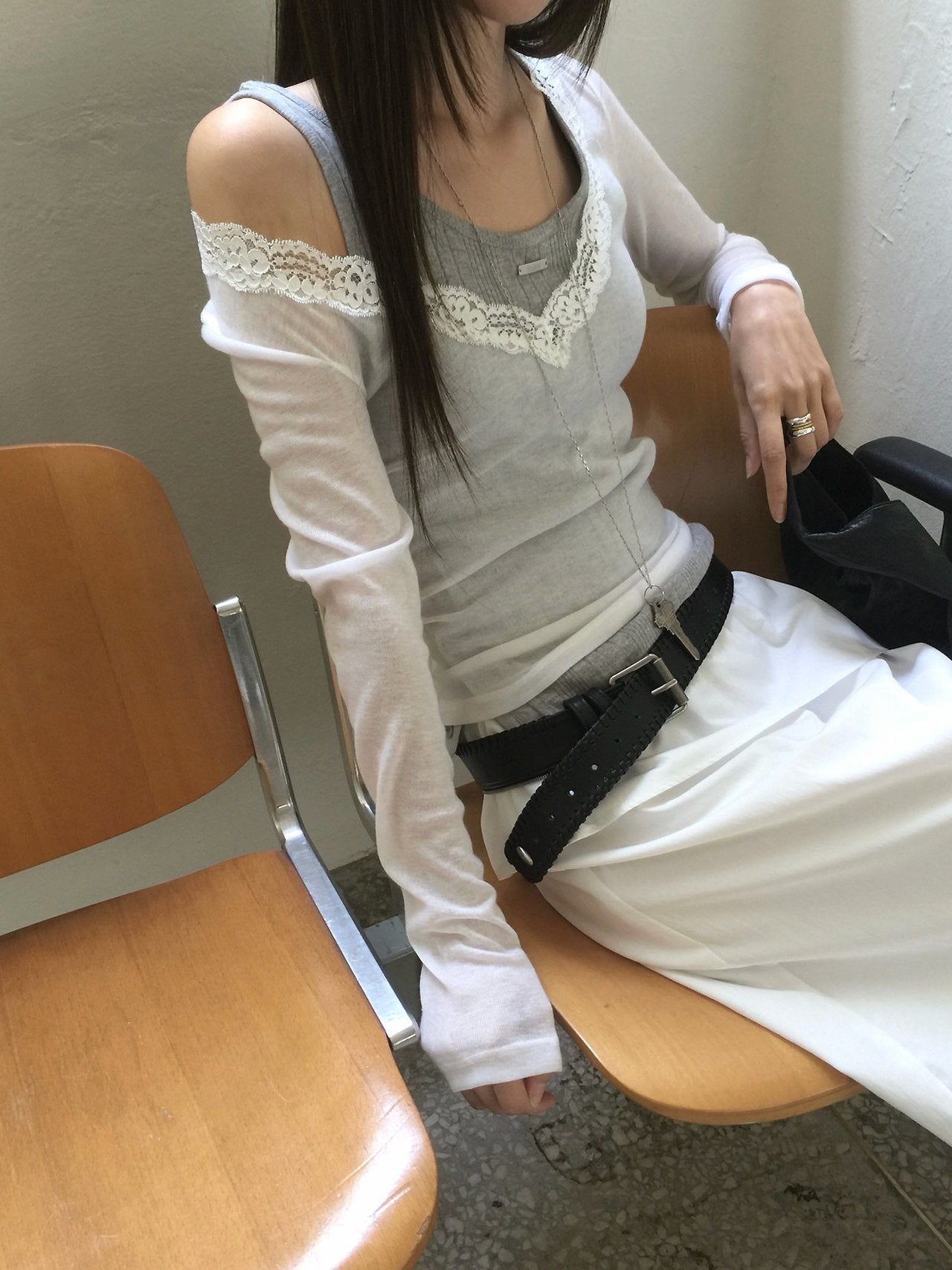 Nweol lace trim V-neck long sleeve top in Grey, styled on model front view with charcoal skirt