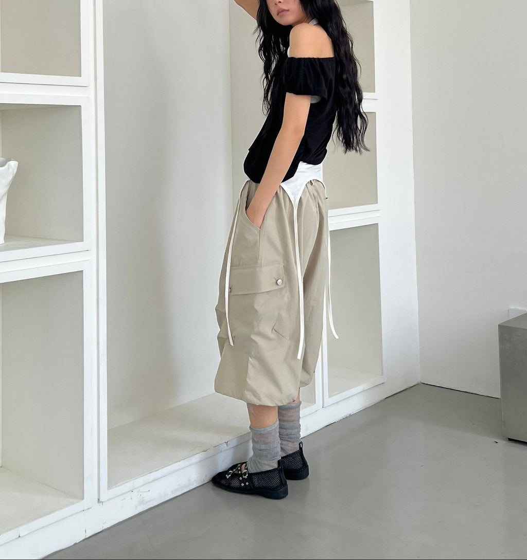 ASKHAKI Off-Shoulder Wide Neck Drawstring Ruffle Pocket Cropped Top
