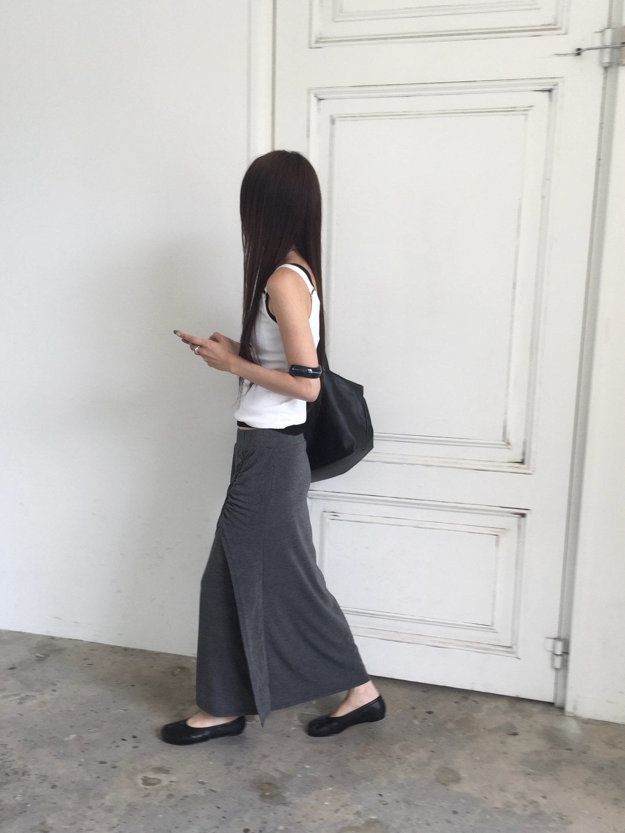 Nweol side ruched maxi skirt in Grey, Charcoal and Black, three colorways on rack front view