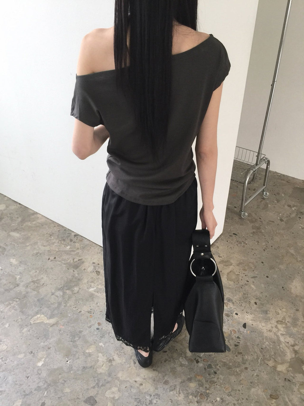 Nweol asymmetric one-shoulder top in Ivory, front view close-up neckline stud detail
