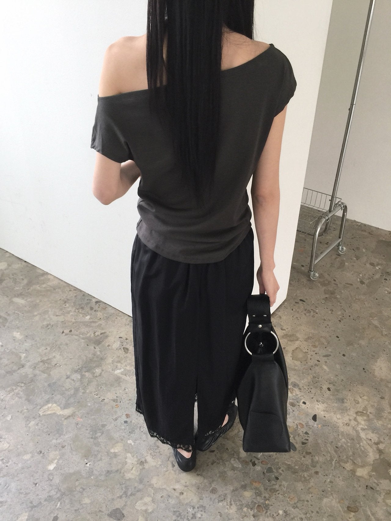 Nweol asymmetric one-shoulder top in Ivory, front view close-up neckline stud detail