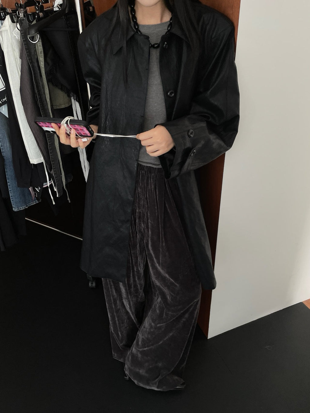 Black leather-look shirt jacket styled with trousers