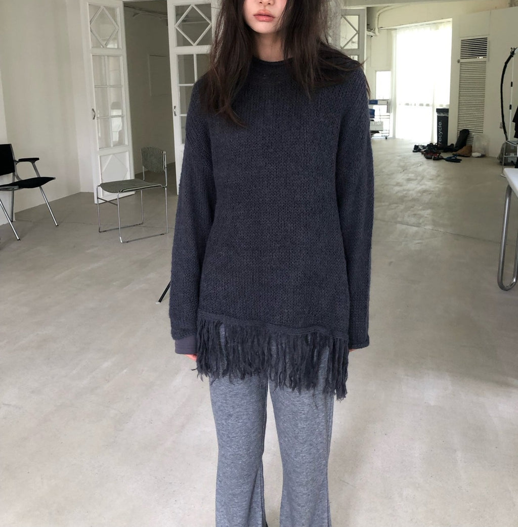 Open-Knit Fringe Sweater Charcoal hanging on rack close-up fringe
