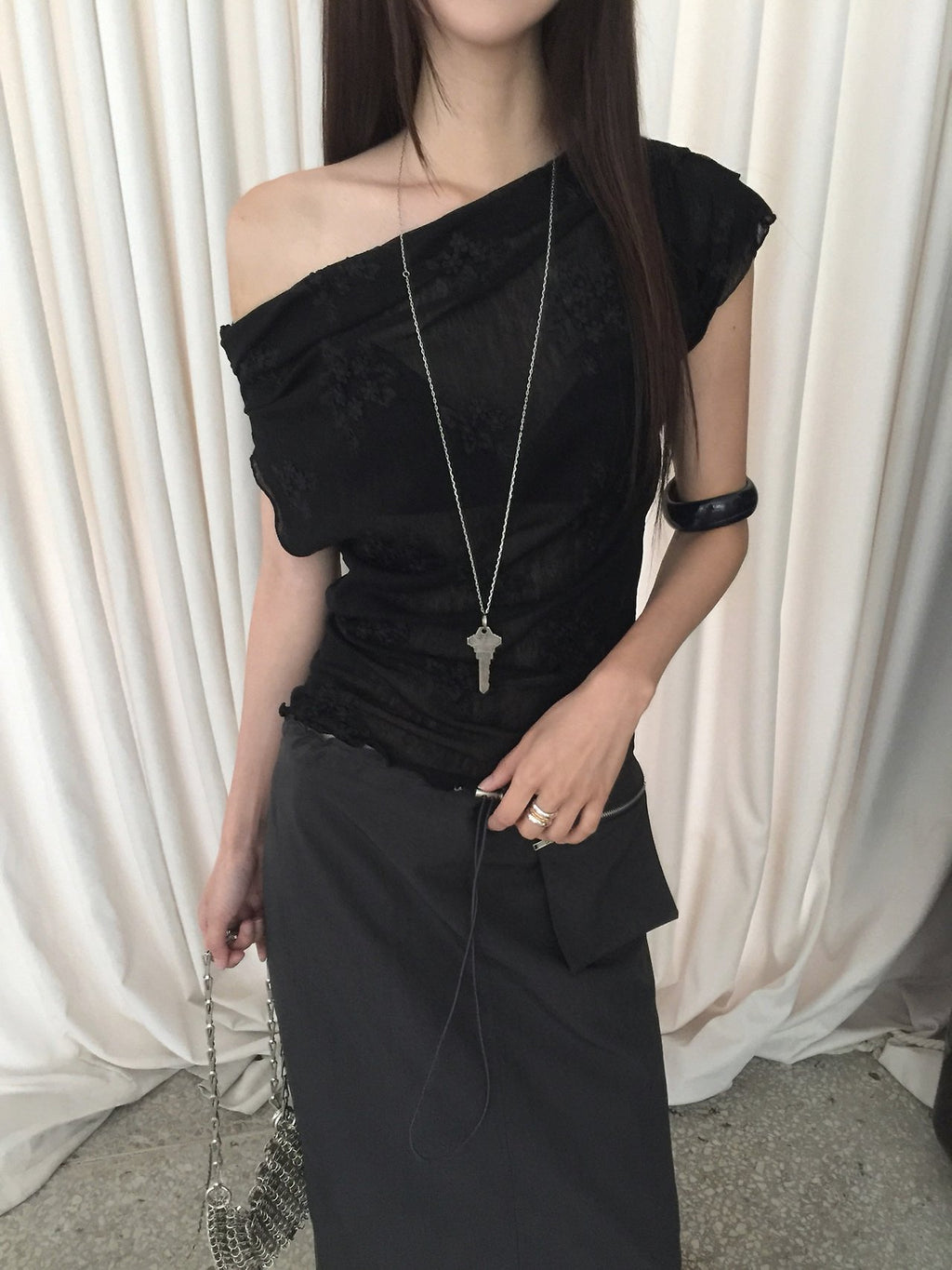 Nweol one-shoulder floral lace mesh top in Black, ruffle hem and mesh texture close-up