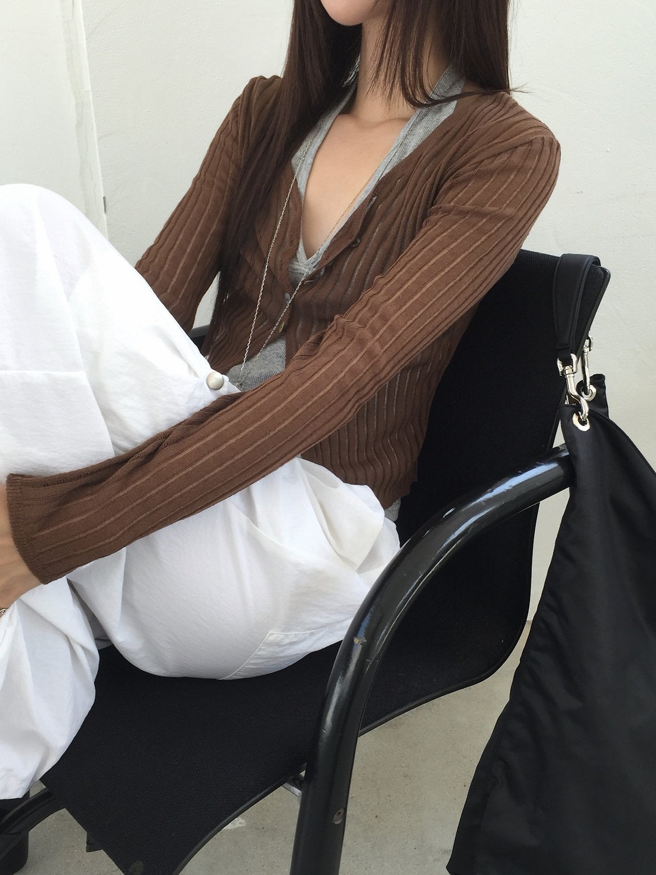 Nweol ribbed open knit crop cardigan in Olive, styled on model front view close-up open knit texture detail