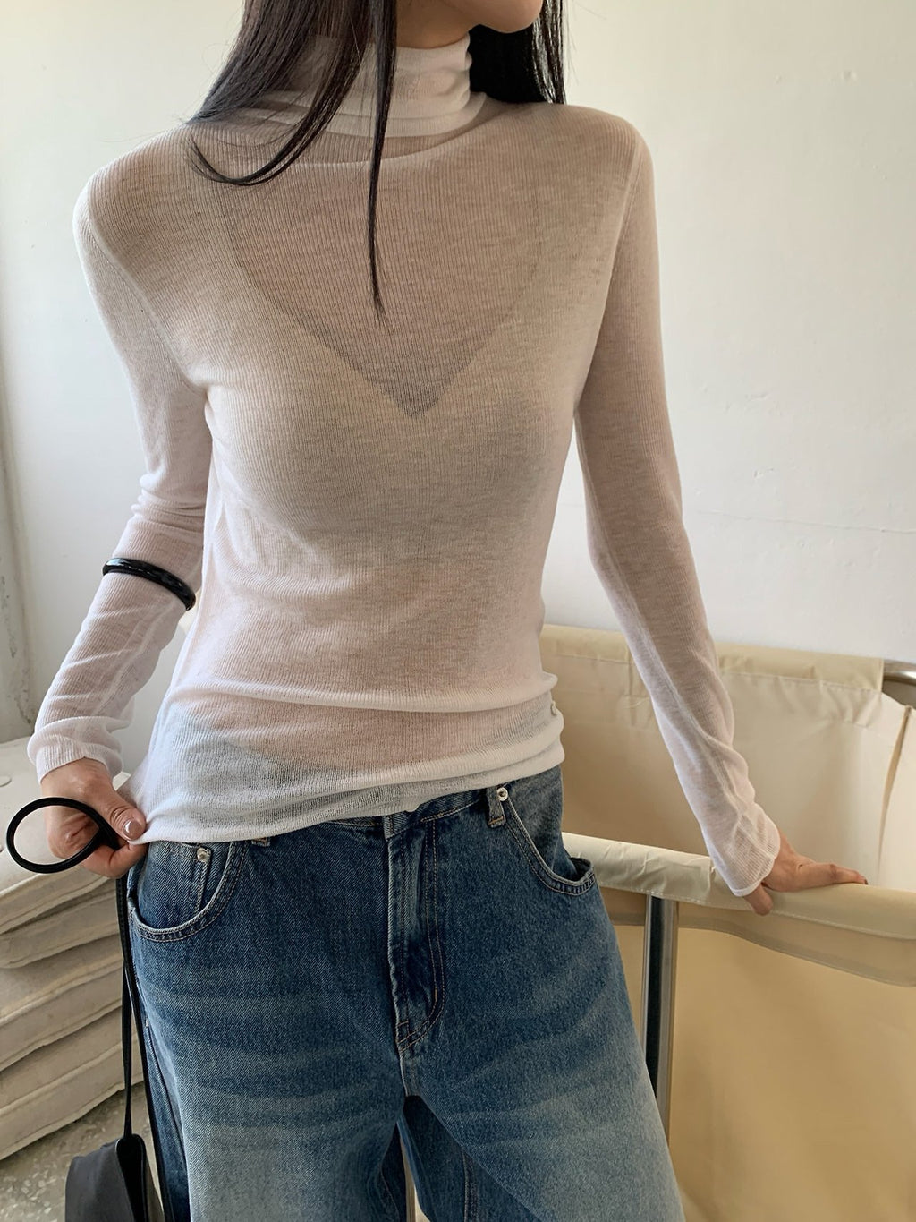 Front view of black long-sleeve turtleneck sweater