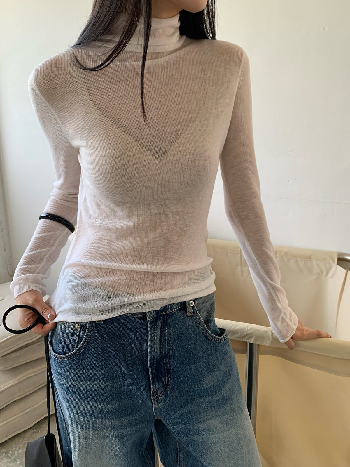 Front view of black long-sleeve turtleneck sweater