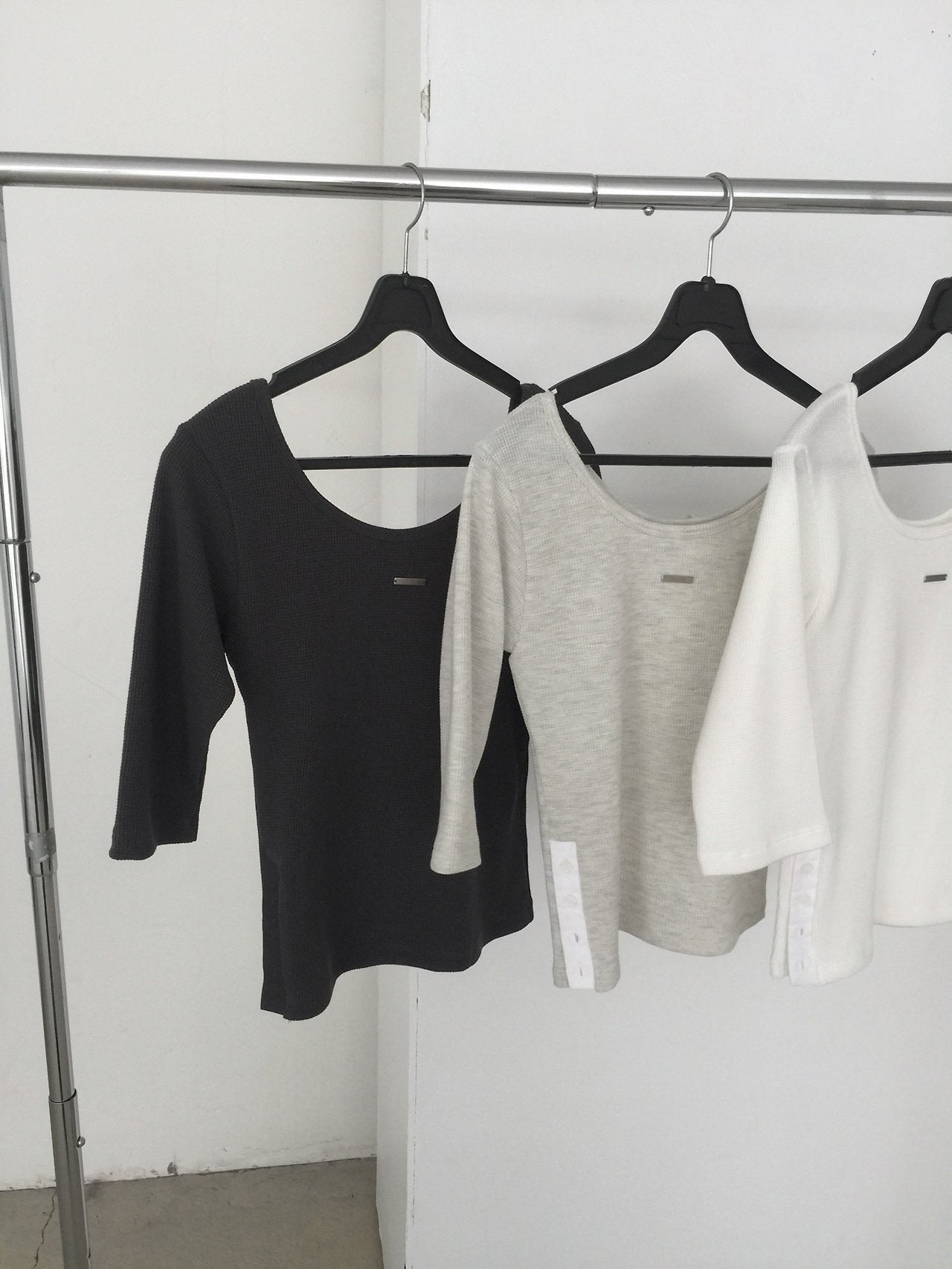Nweol waffle knit crop half sleeve top in White Melange, product flat lay front view on white surface