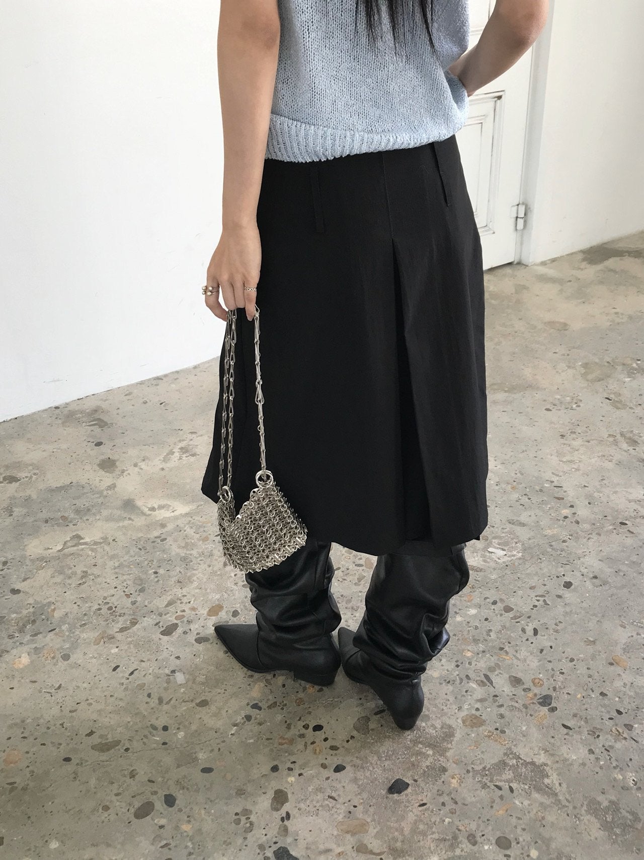 Newol Double Buckle Eyelet Pleated Midi Skirt — Asymmetric Hem