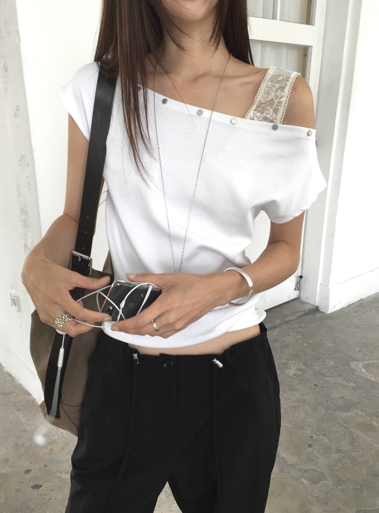 Nweol asymmetric one-shoulder top in Ivory, front view standing close-up