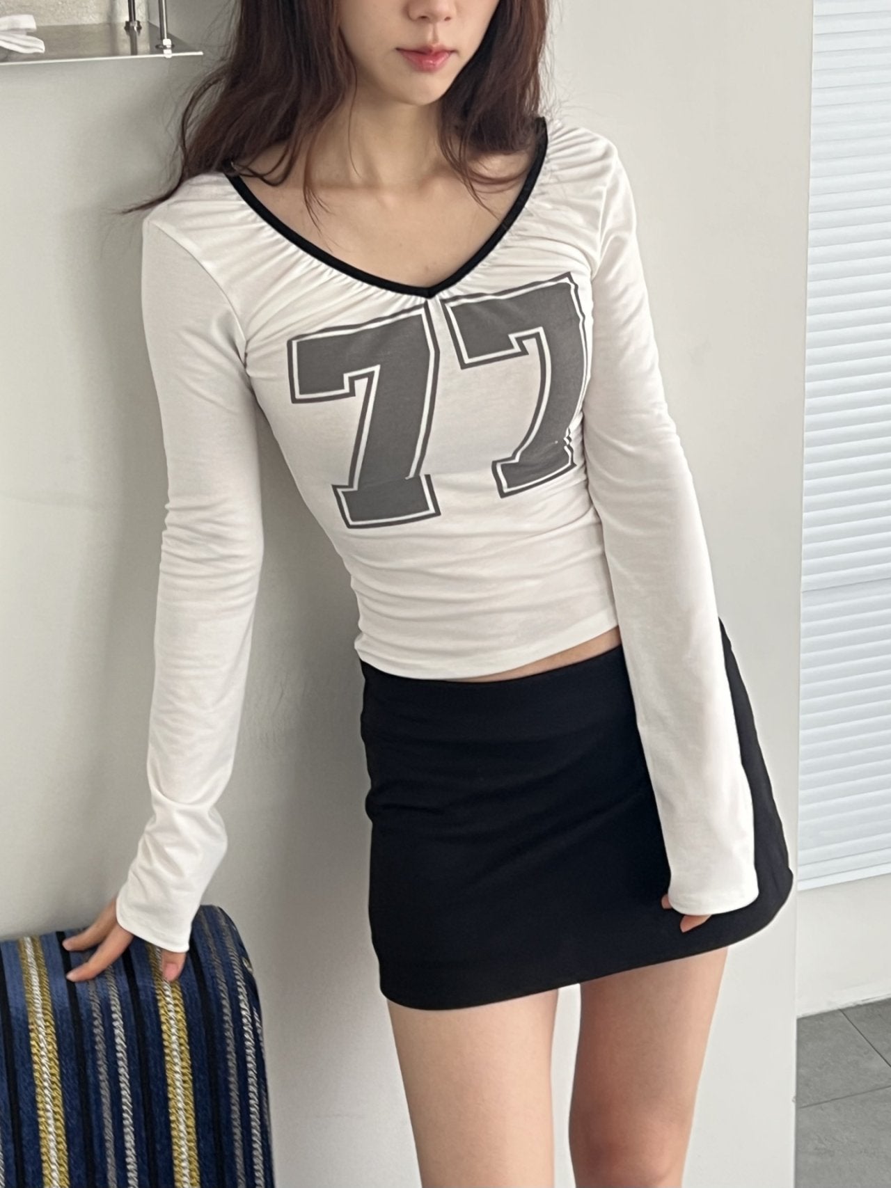 ASKHAKI 77 Number Print Open-Back Cropped Long Sleeve Top