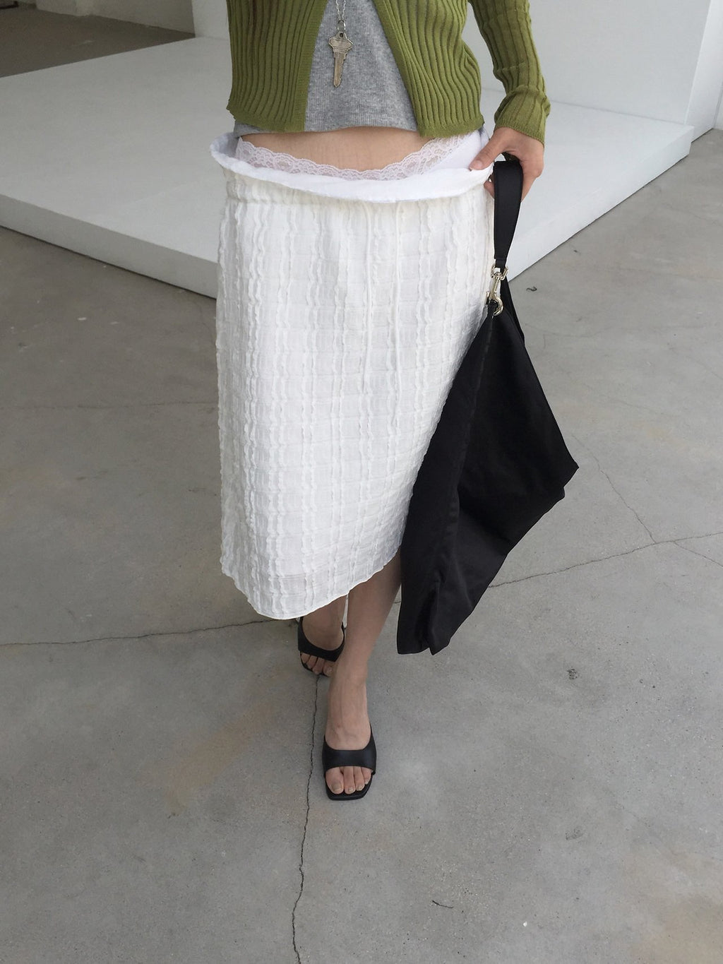 Nweol bubble texture midi skirt in Ivory and Black, two colorways product flat lay front view