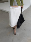 Nweol bubble texture midi skirt in Ivory and Black, two colorways product flat lay front view