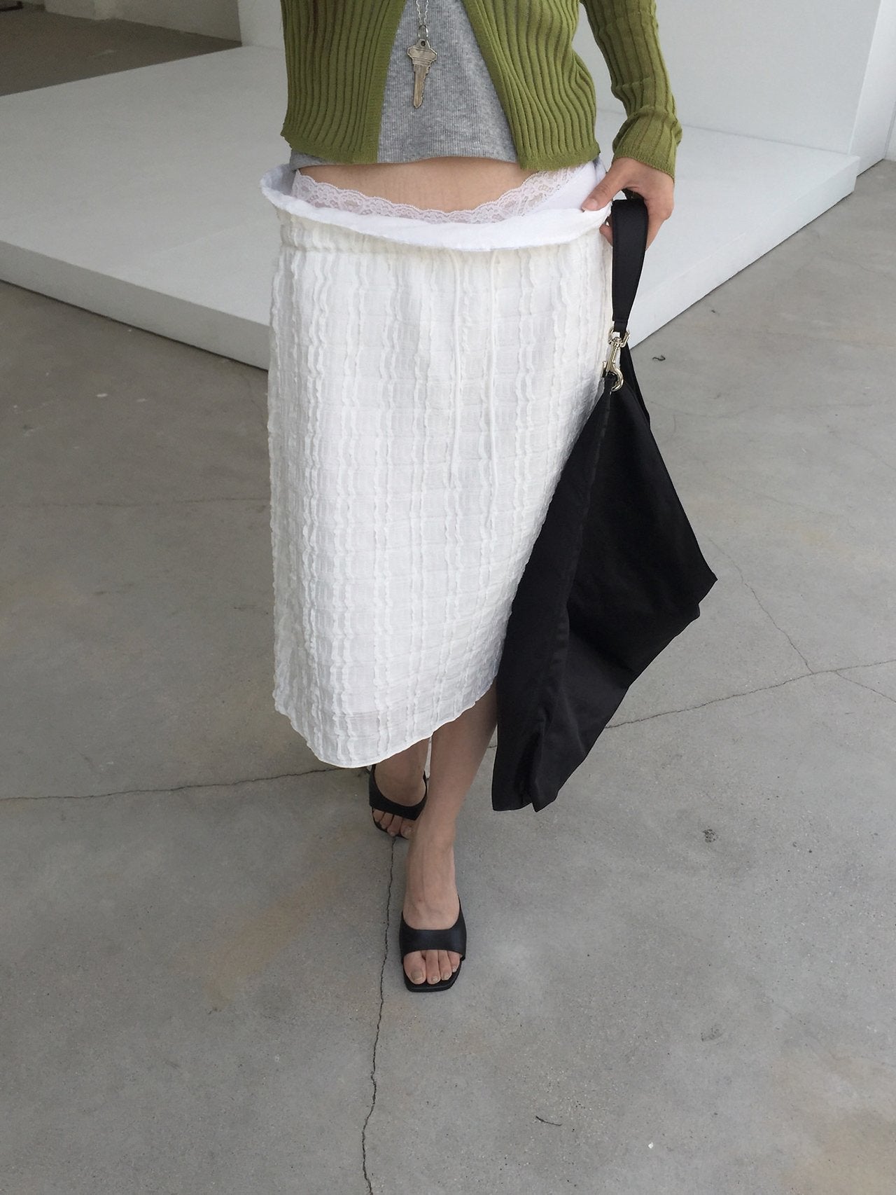 Nweol bubble texture midi skirt in Ivory and Black, two colorways product flat lay front view