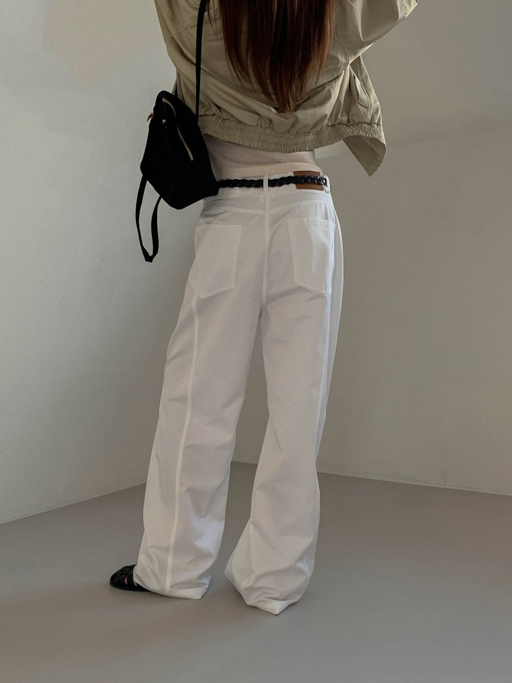 Moment curved seam wide leg pants in Beige, back view full length on model