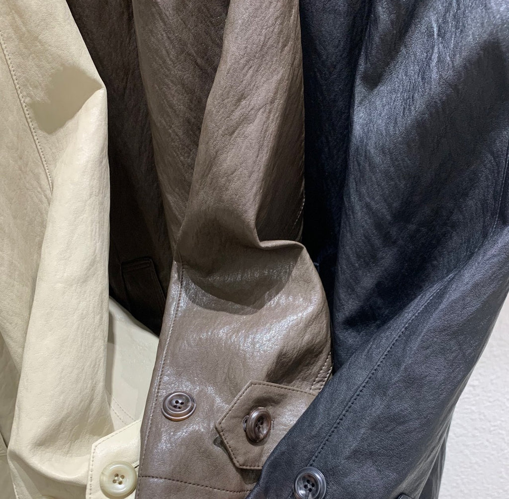 Close-up of Lucysalon Beige, Brown and Black leather-look jacket material